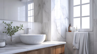 A clean and white marble bathroom basin